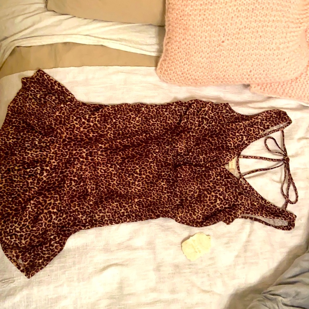 Fun cheetah dress with tie on back. V cut in front and back. Never worn